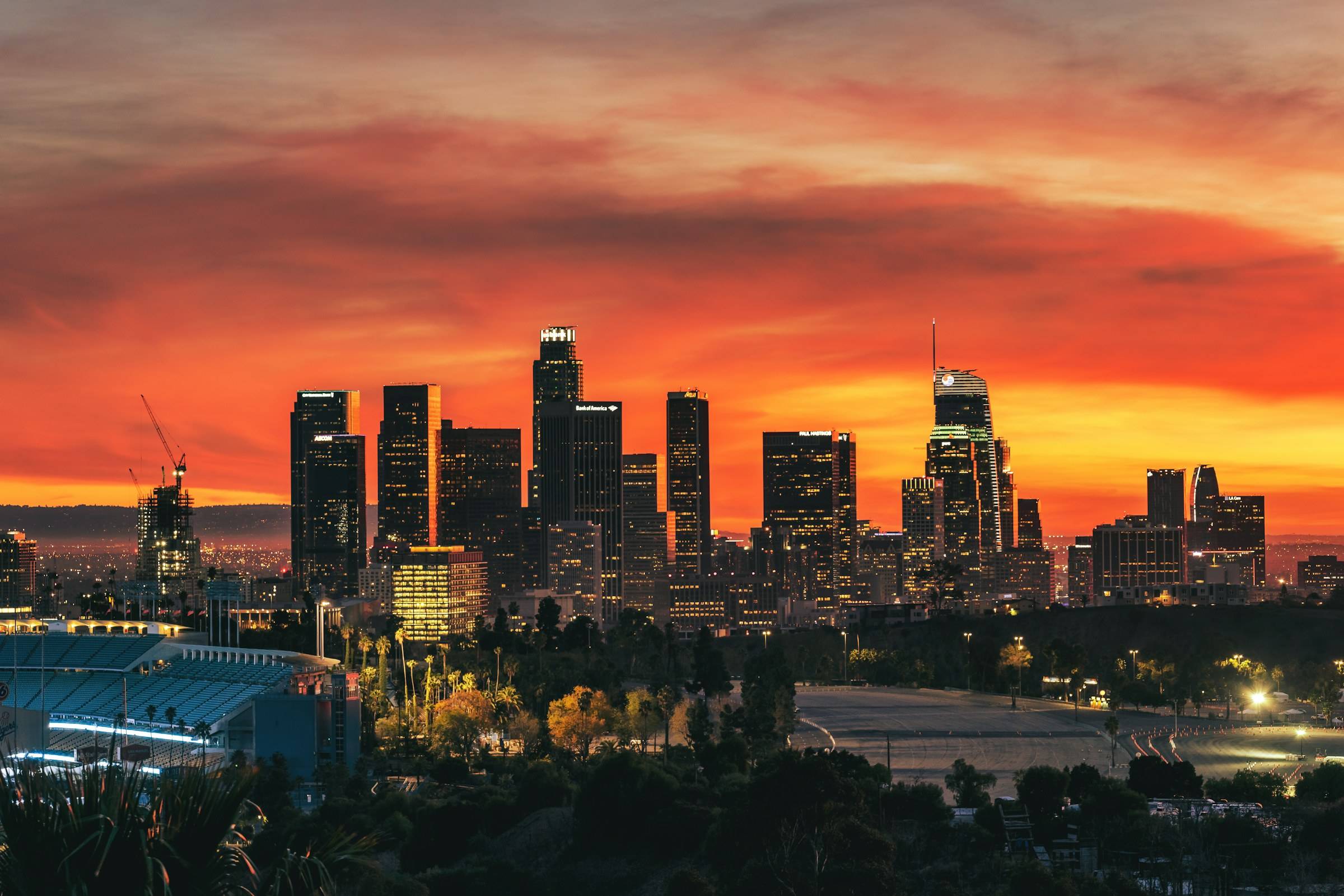 Downtown Los Angeles skyline under a burning orange sunset