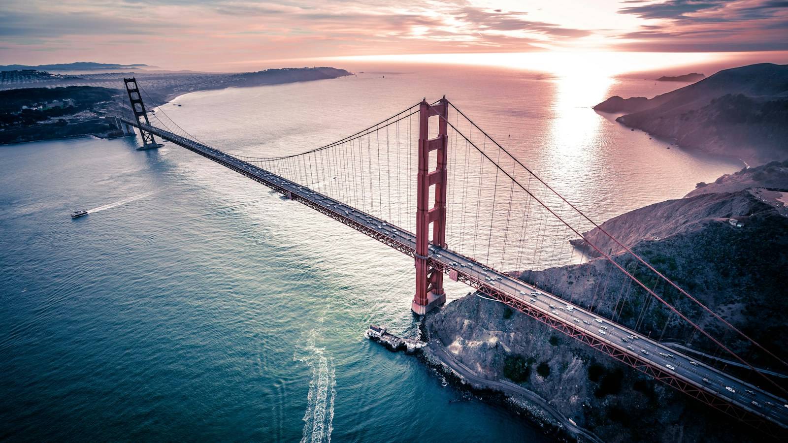 Aerial view of the Golden Gate Bridge with San Francisco Bay at sunset